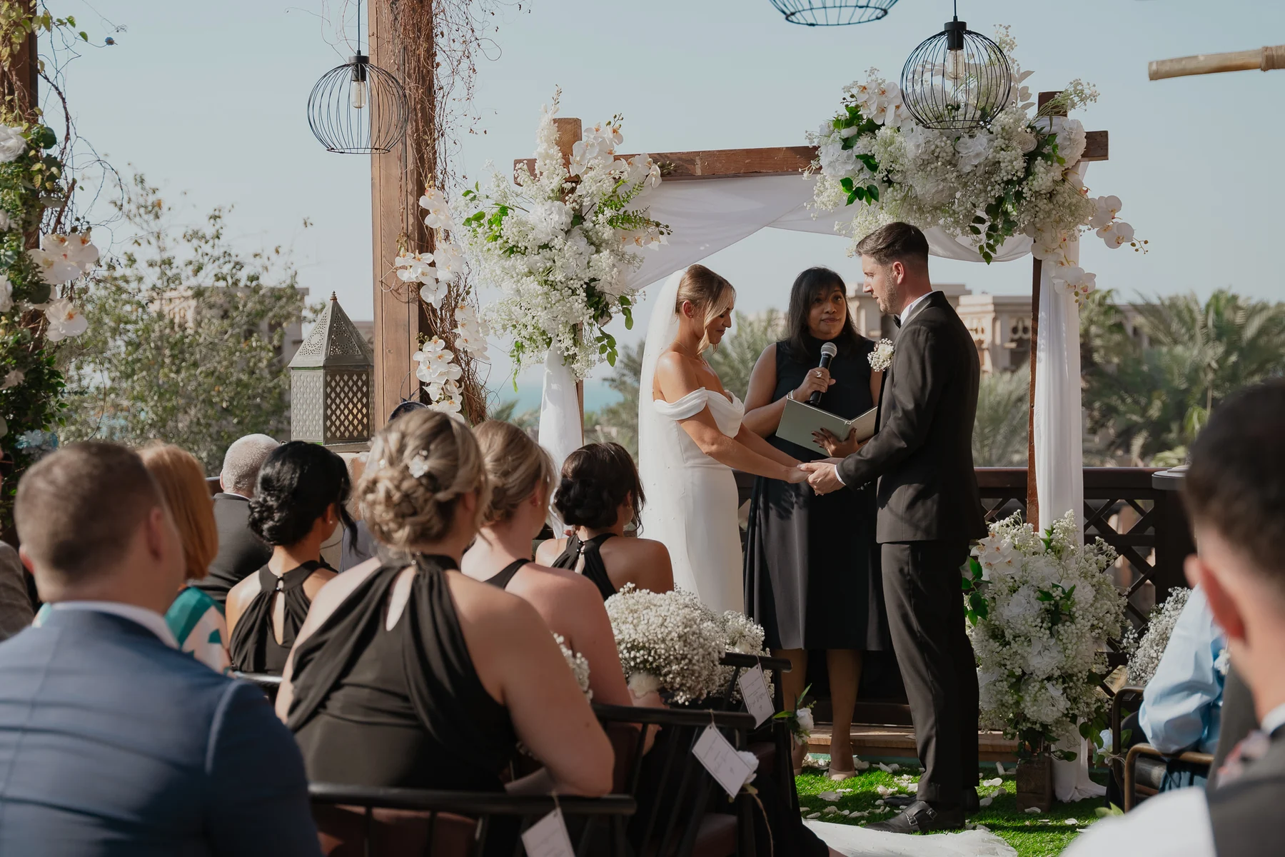 Outdoor ceremony with guests watching