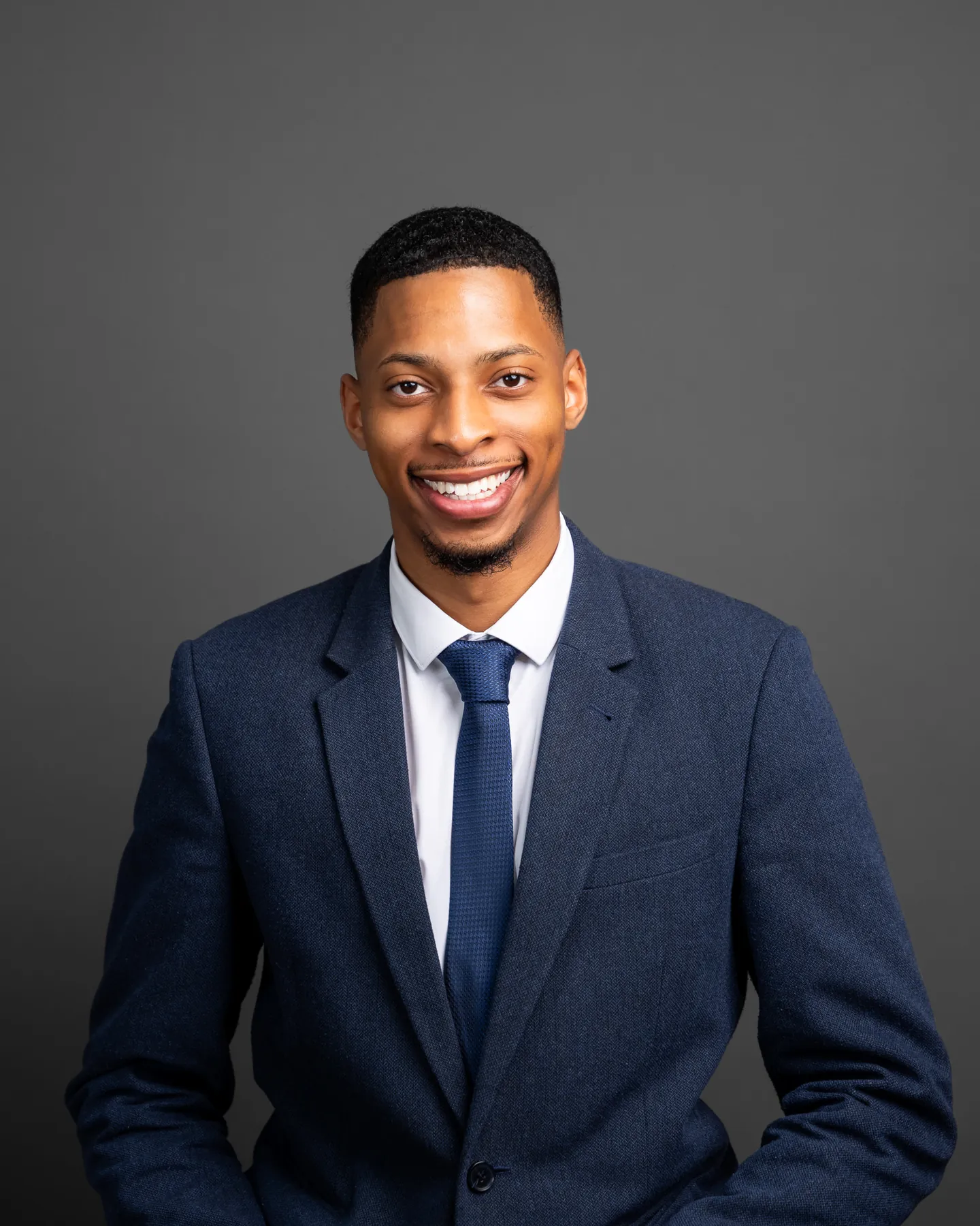 Smiling professional in a navy suit