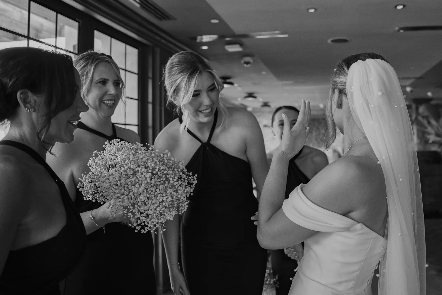 Bride with her bridesmaids, black and white