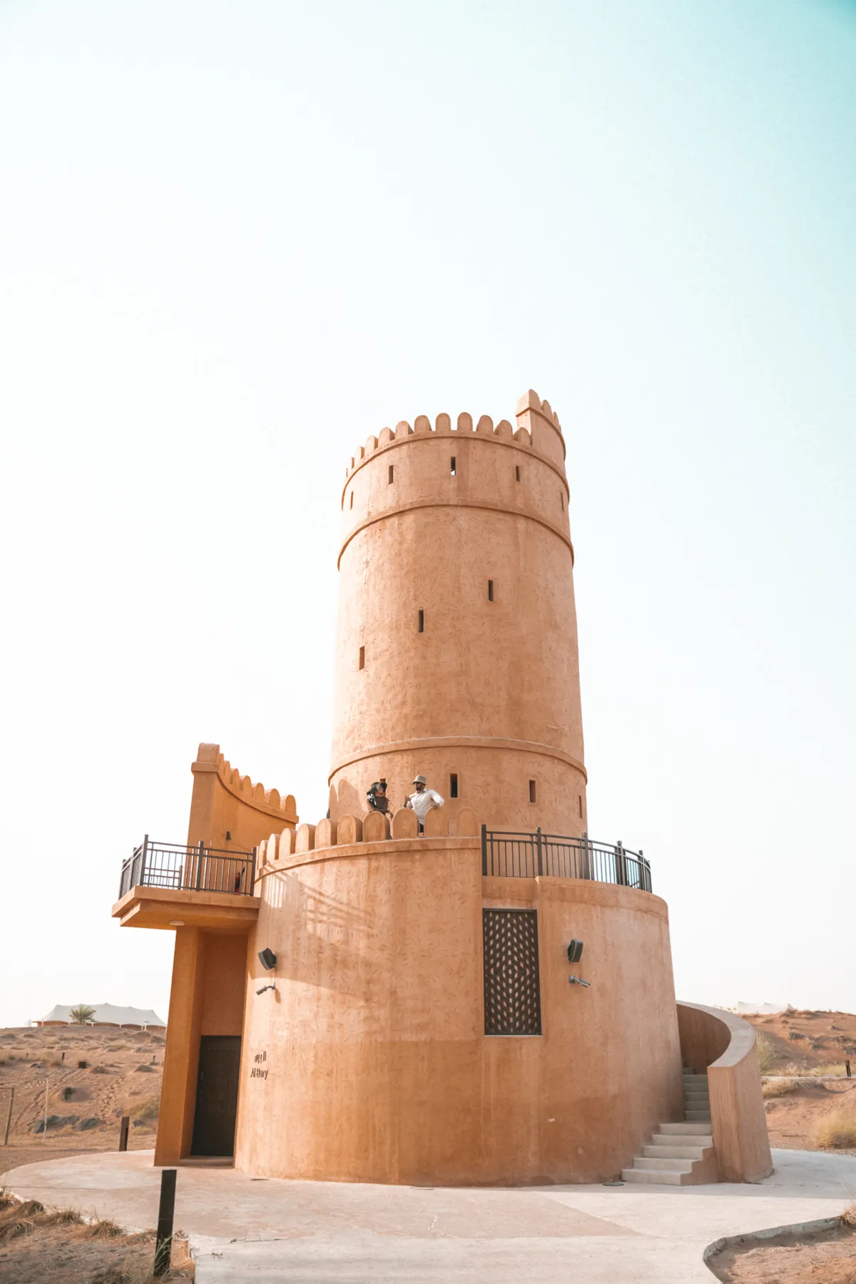Historic watchtower against a pale sky