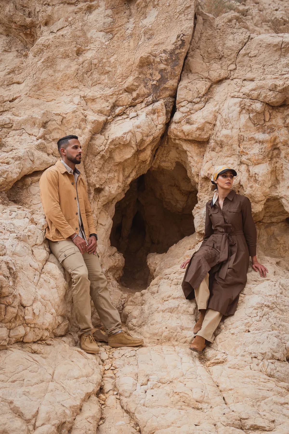 Two figures among desert rock formations