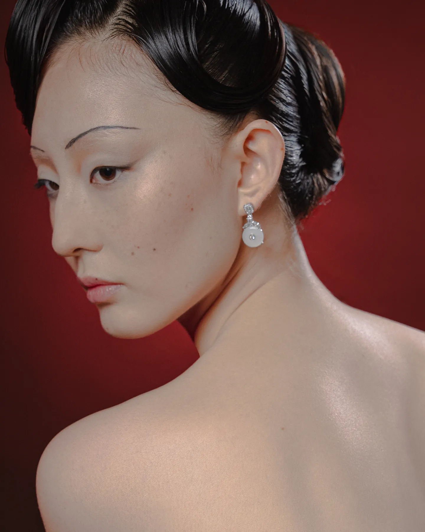 Beauty portrait against a deep red backdrop