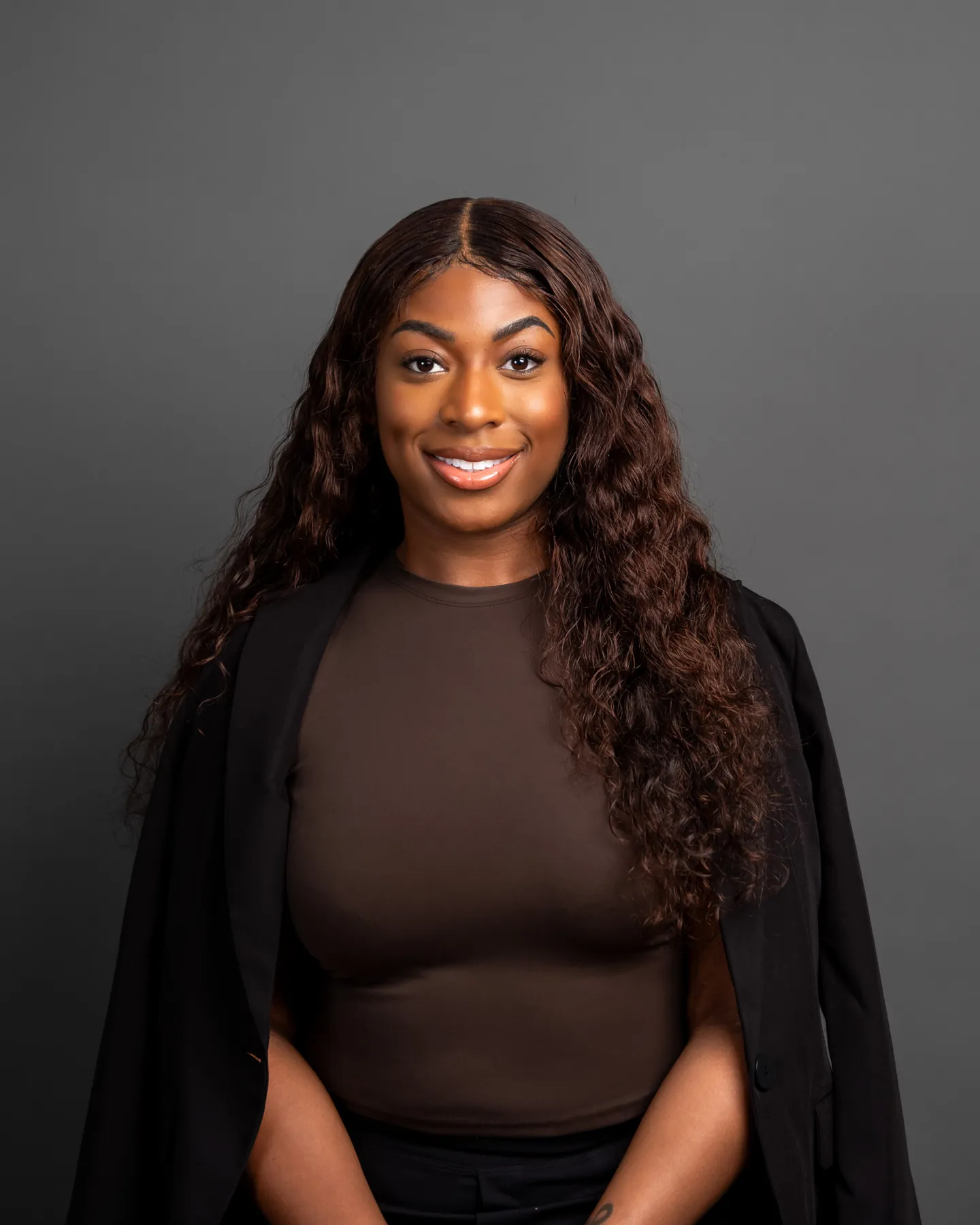 Professional portrait of a woman with long curly hair
