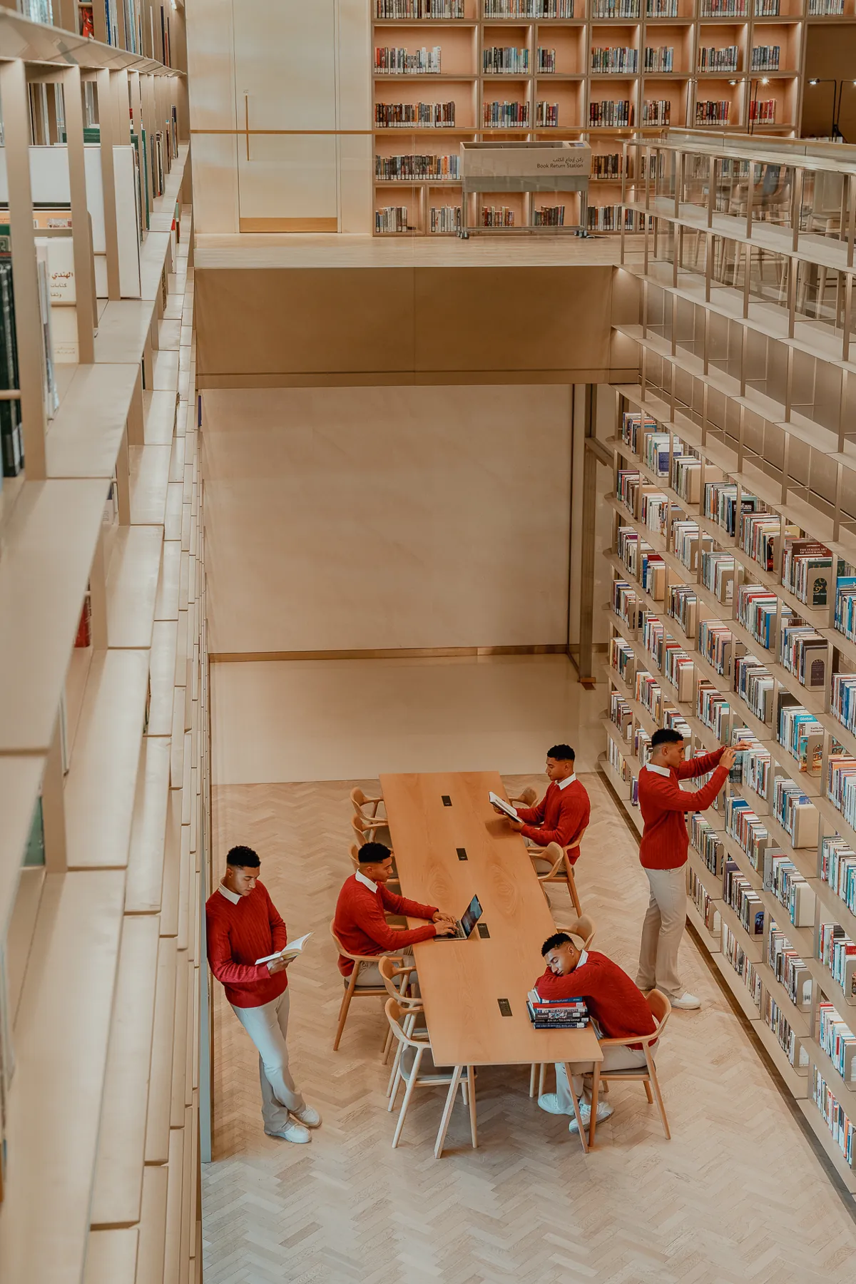 Library scene with figures in red