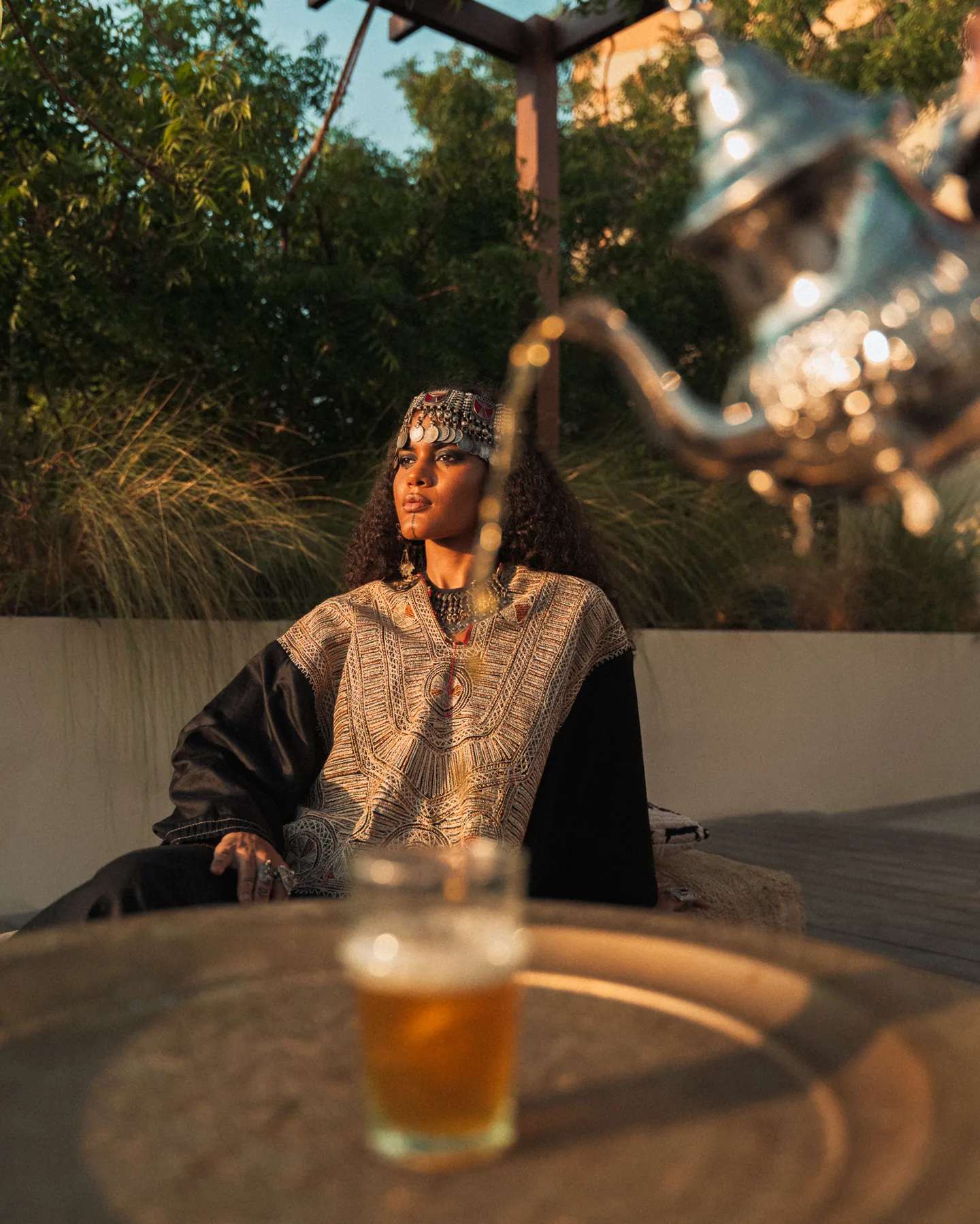 Tea being poured in a garden setting