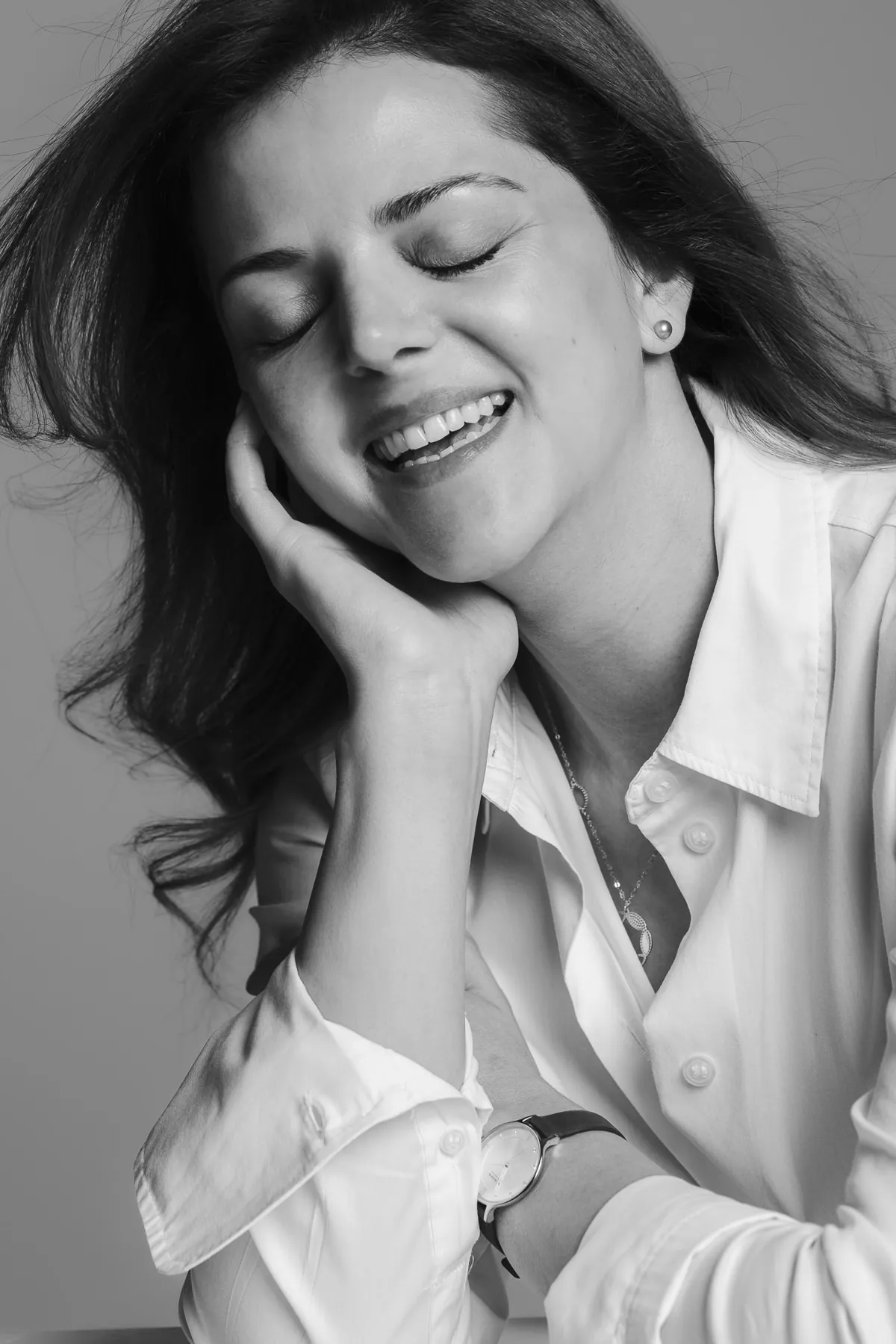 Black and white portrait of a laughing woman